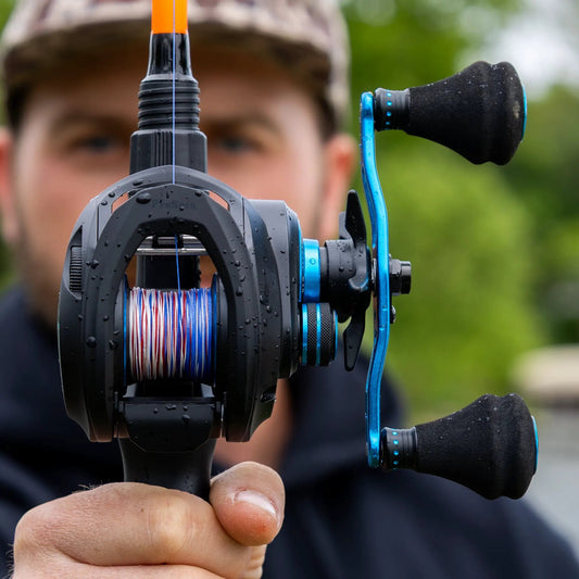 Reaction Tackle ProSpin Baitcasting Reel 6.8:1 gear ratio, black body with blue accents on Tampa Home & Garden Store