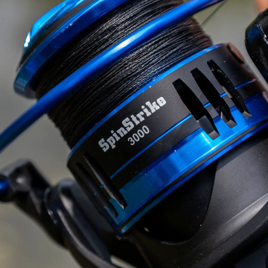 Reaction Tackle blue high-performance spinning reel with braided line spool detail on Tampa Home & Garden Store