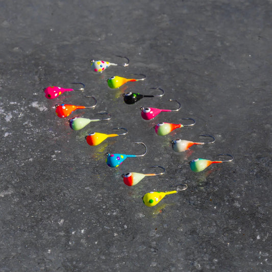 Reaction Tackle ice fishing jigs for panfish, colorful teardrop lures scattered on ice on Tampa Home & Garden Store