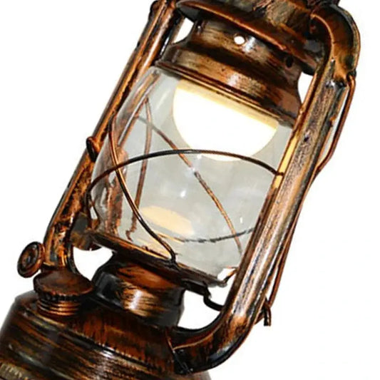 Retro kerosene wall lamp in antique bronze with glass lantern and iron hardware on Tampa Home & Garden Store