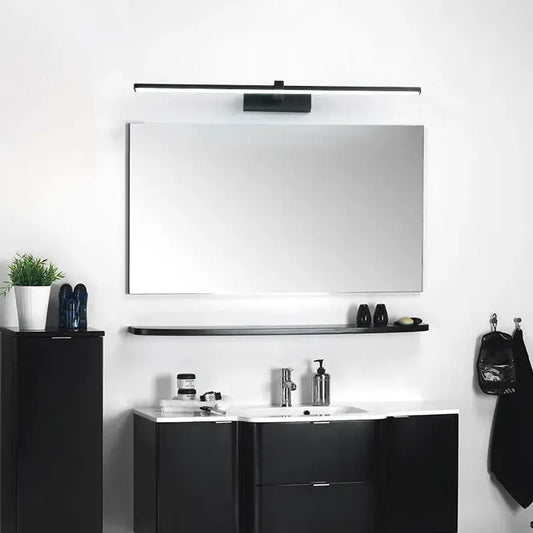 LED bathroom mirror light bar in black metal above a rectangular mirror on a white vanity on Tampa Home & Garden Store