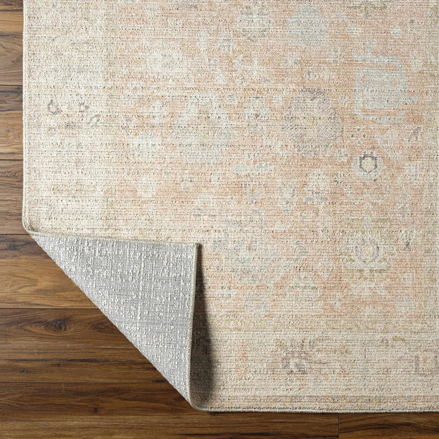 Marlene machine woven area rug by Boutique Rugs in beige with subtle pattern on wood floor on Tampa Home & Garden Store