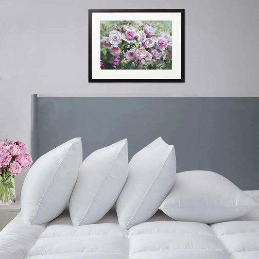 Set of 4 white down-alternative pillows on a bed with gray headboard on Tampa Home & Garden Store