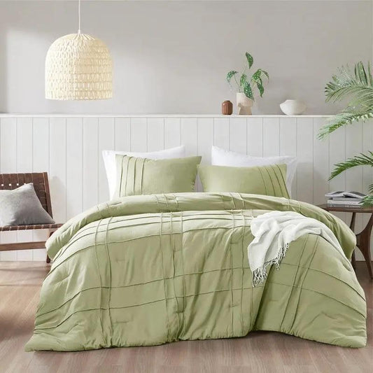 King Microfiber Pleated Comforter Set Sage Green on white-paneled bed with white pillows on Tampa Home & Garden Store