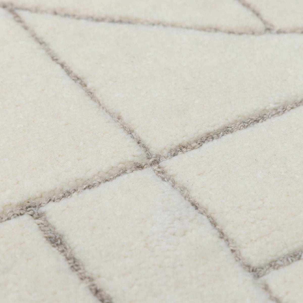 Fusao Off White Area Rug with cream tones and subtle grid lines by Boutique Rugs on Tampa Home & Garden Store