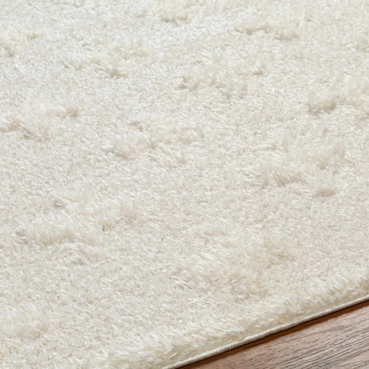 Satu Cream Area Rug machine-woven polyester plush ivory shag bound edge on Tampa Home & Garden Store