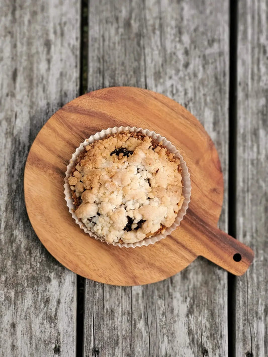 KORISSA wooden round serving board for cheese and fruit with crumb pastry on parchment liner on Tampa Home & Garden Store