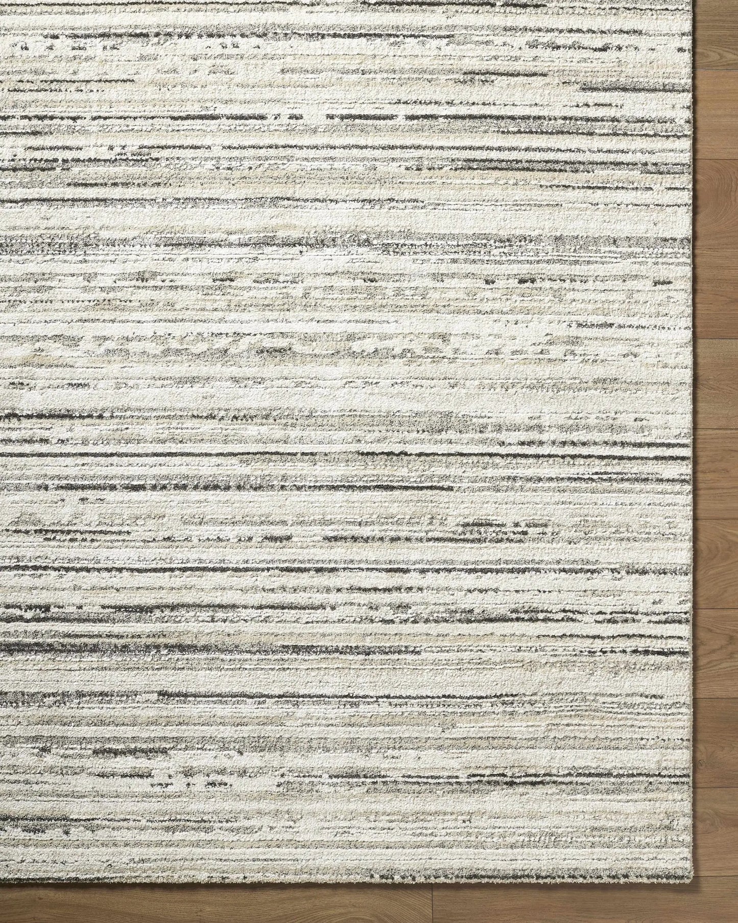 Sanja Luxe Rug in white cream beige with black stripes on wood floor on Tampa Home & Garden Store