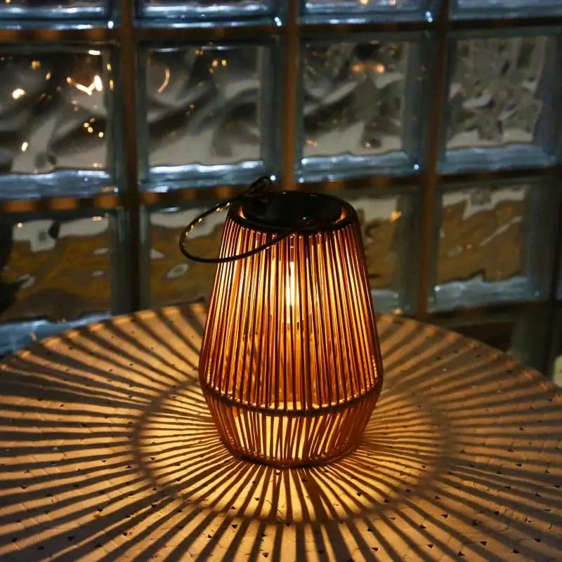 Outdoor solar hanging lantern Moktan Sabai, brown bamboo glow casting patterns on Tampa Home & Garden Store