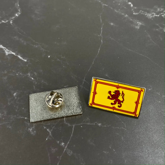 Saltire and Royal Flags of Scotland enamel pin yellow crest with red dragon on dark surface on Tampa Home & Garden Store
