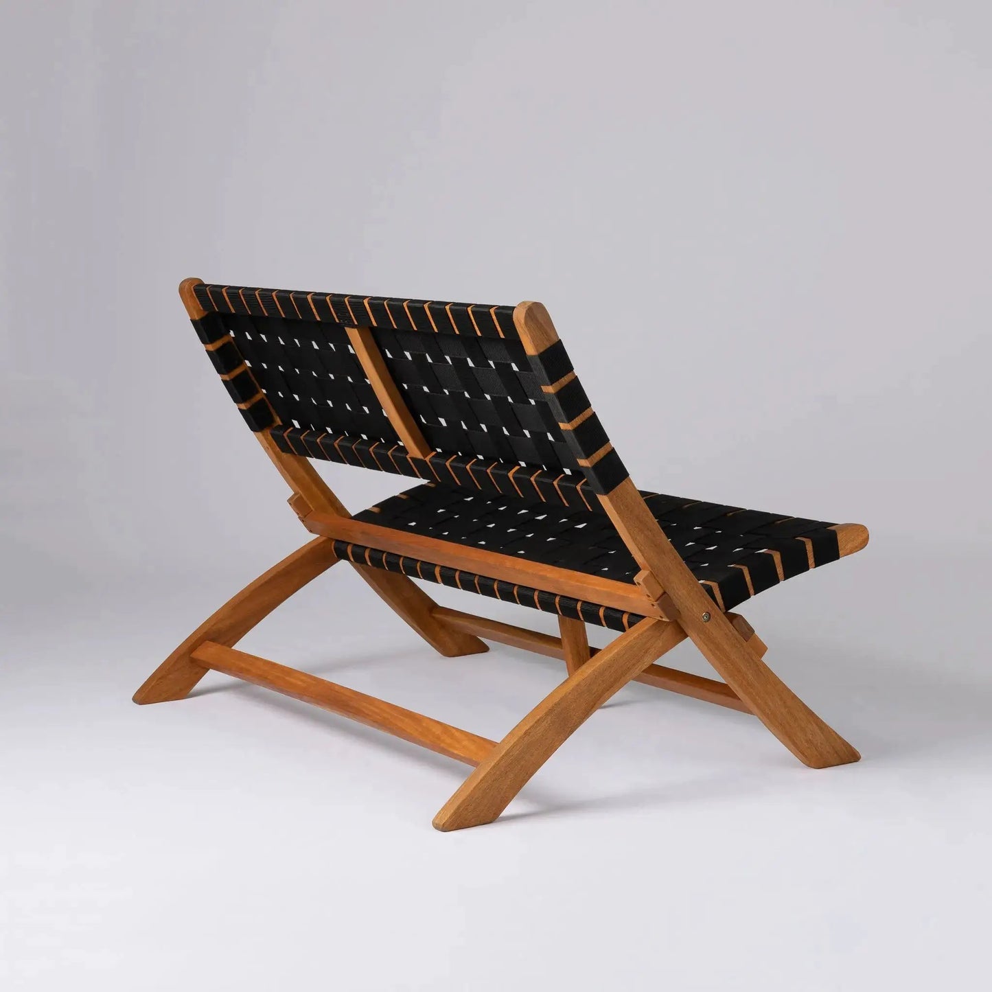 Sava folding bench in acacia wood with black woven seat and orange trim for indoor outdoor use on Tampa Home & Garden Store