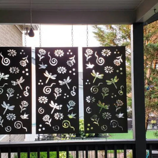 Outdoor metal privacy panels: three black steel screens with dragonfly cutouts, chains on Tampa Home & Garden Store