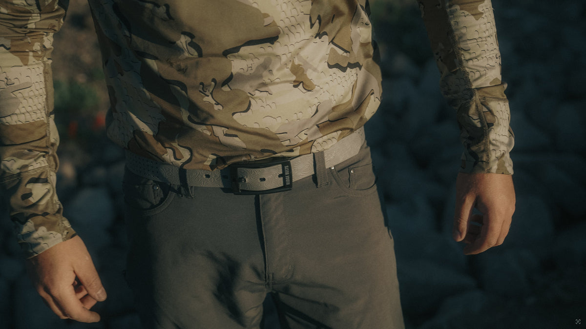Lightweight Ridge Belt, gray embossed belt with Ridge Belts logo worn with desert camouflage shirt on Tampa Home & Garden Store