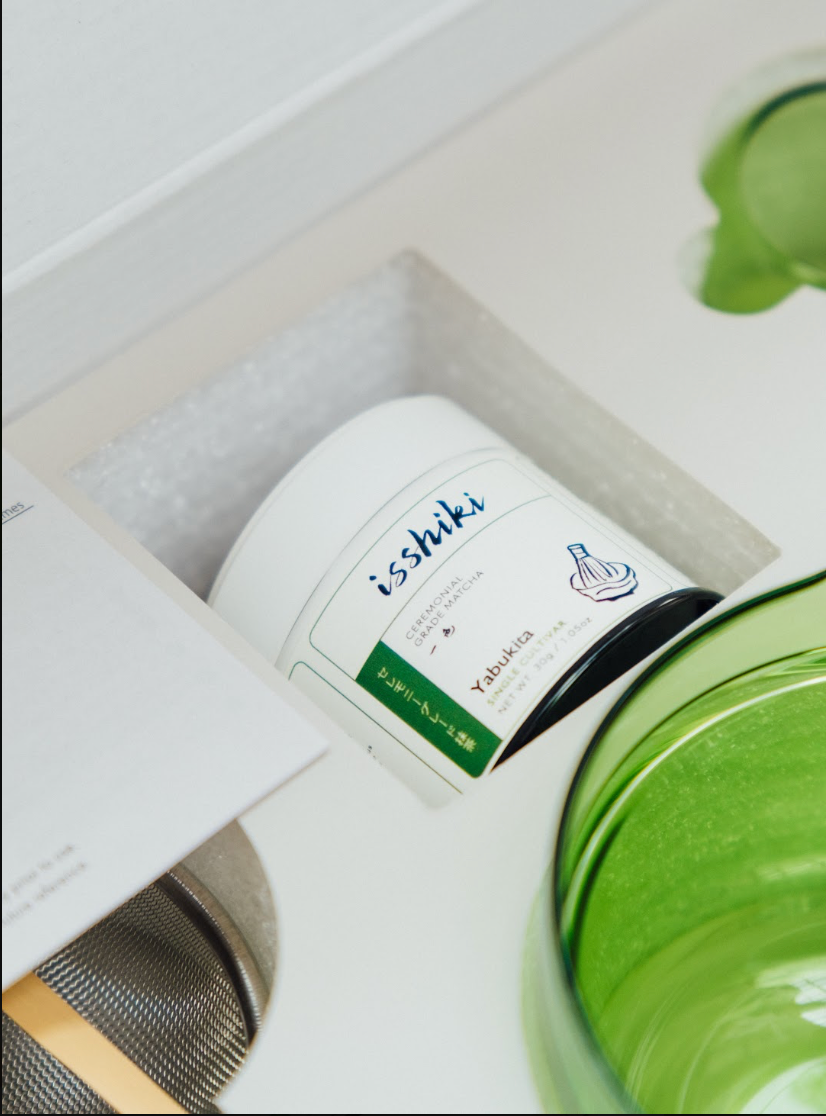 Isshiki x Hario Yabukita tin matcha set cup with white label tin nearby a green tea bowl on Tampa Home & Garden Store