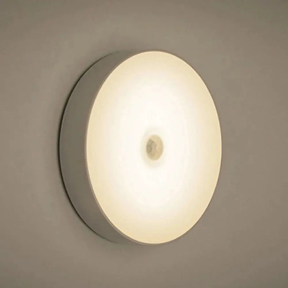 Motion Sensor LED Night Light circular white wall lamp with warm ambient glow on Tampa Home & Garden Store