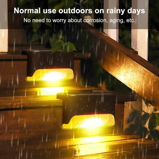 Outdoor solar deck lights and LED path lamps with black housing and warm yellow glow, 3 units on Tampa Home & Garden Store