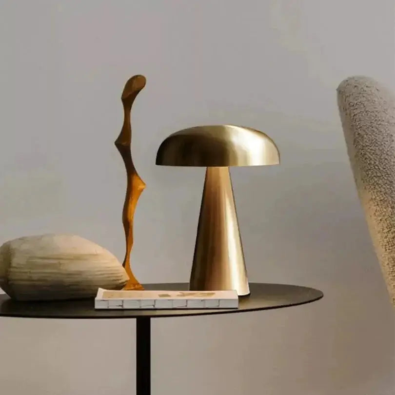 Rechargeable LED brass mushroom table lamp with touch control Moktan Sabai on black table on Tampa Home & Garden Store