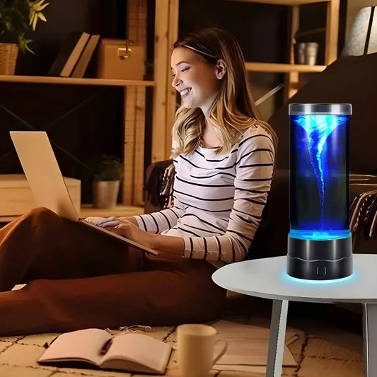 LED Tornado Night Light USB Multi-Color Lamp with blue tornado glow in a cylindrical lamp on a table on Tampa Home & Garden Store