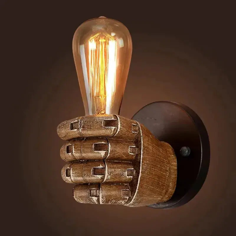 Resin hand lamp fist sconce with warm Edison bulb in rustic Moktan Sabai wall light fixture on Tampa Home & Garden Store