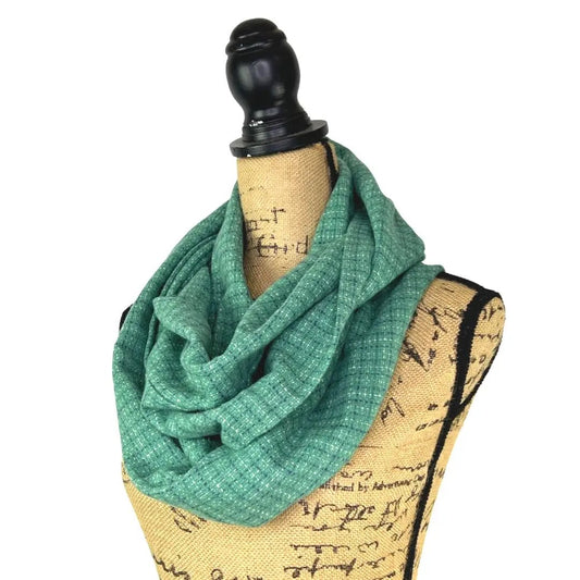 Seafoam Green small check plaid flannel scarf draped around a mannequin neck on Tampa Home & Garden Store