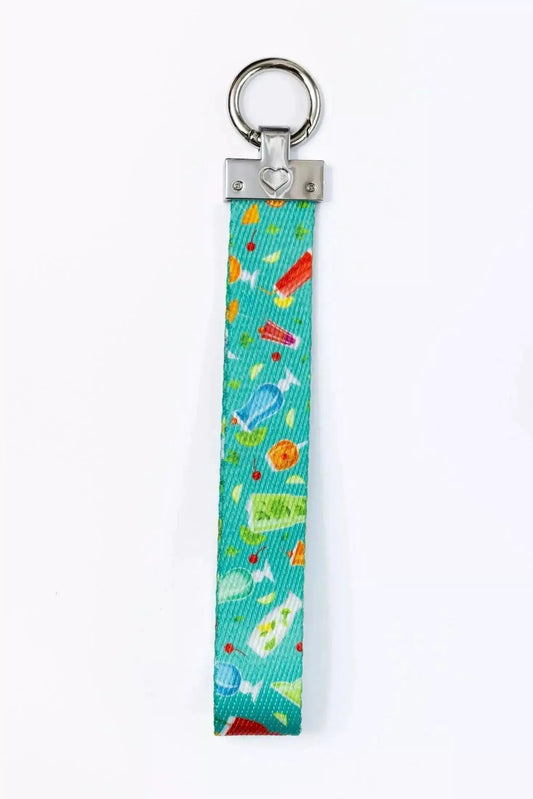 Seaside Sips Wristlet Keychain for Dogs by Aria the Fox, turquoise patterned fabric with metal ring and heart accent on Tampa Home & Garden Store
