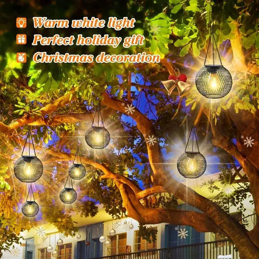 Ortiny Solar Lanterns waterproof hanging lights with warm white glow, set of 7 in tree scene on Tampa Home & Garden Store