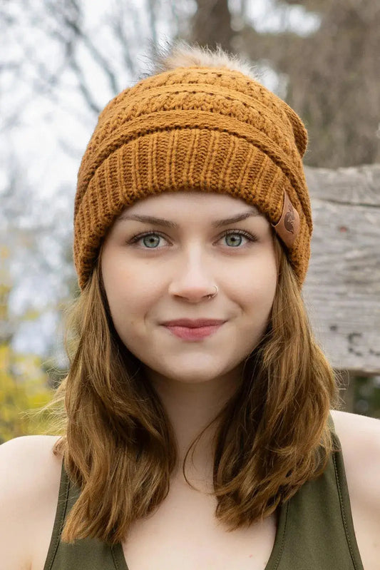 Sequoia Ribbed Knit Beanie with Pom in caramel, Aria the Fox patch on cuff visible on Tampa Home & Garden Store