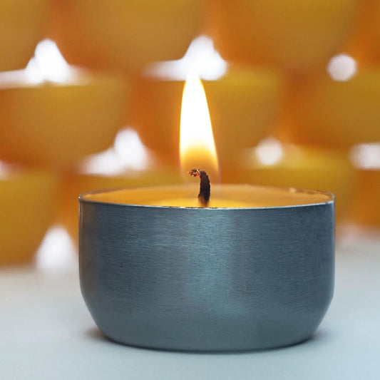 Montana Beeswax Tealight Candles in a blue metal cup handmade warm flame on Tampa Home & Garden Store