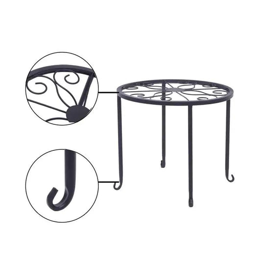 Set of 4 indoor outdoor black metal plant stands with round tops and scrollwork on Tampa Home & Garden Store