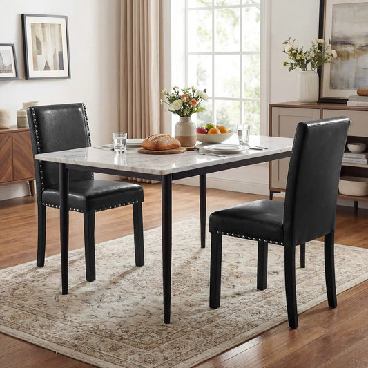 Set of 4 black dining chairs with faux leather upholstery, nailhead trim, and rubberwood legs on Tampa Home & Garden Store