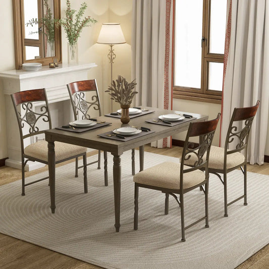 Set of 2 armless dining chairs with beige cushions and decorative metal scrollbacks on Tampa Home & Garden Store