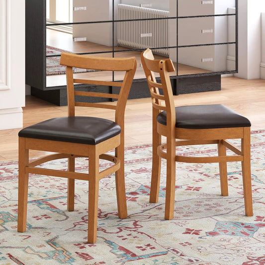Pair wooden dining chairs with rubber wood legs; light oak finish and black cushioned seats on Tampa Home & Garden Store