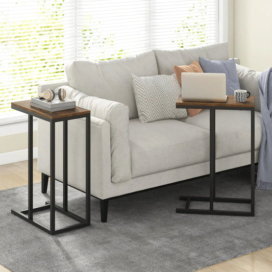 C-shaped end table set of two with brown wood tops and black metal frames beside a light gray sofa on Tampa Home & Garden Store