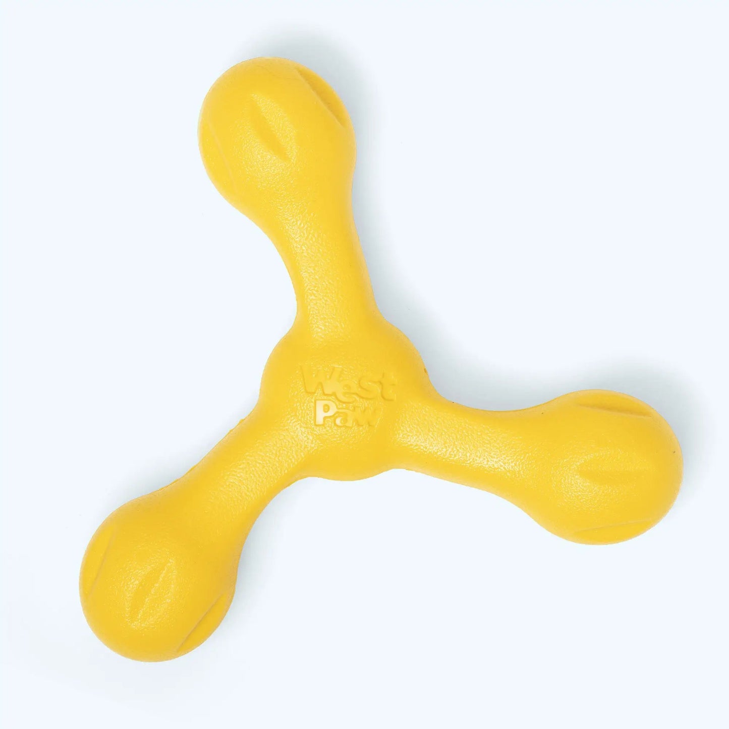 Skamp dog toy by West Paw Zogoflex Echo, bright yellow bone-shaped rubber toy on Tampa Home & Garden Store