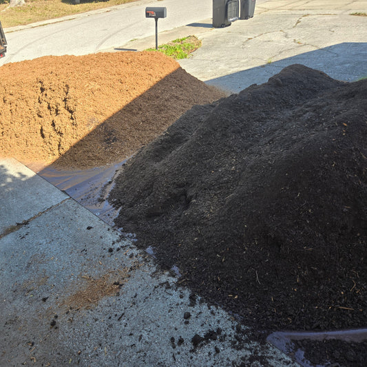 Soil and mulch delivery executed in one trip and dumped on a tarp on the driveway.