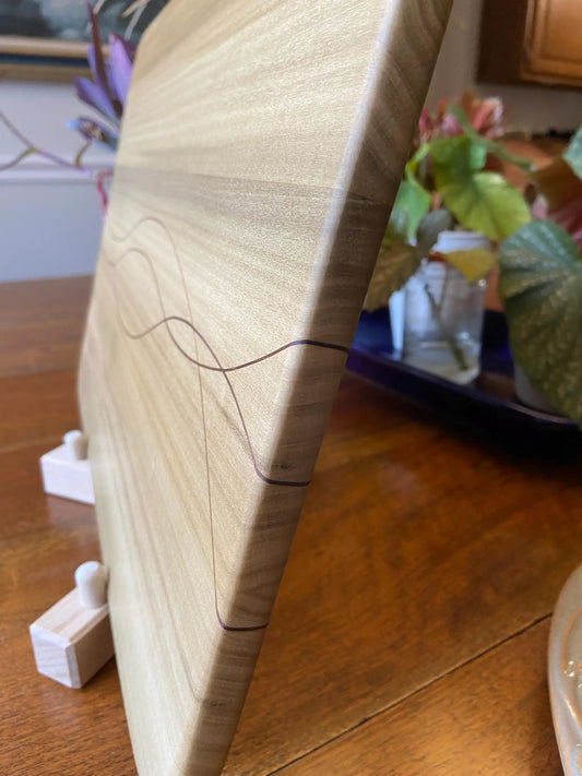 Poplar charcuterie board with walnut inlay and curved edge by Fitzgerald Custom Woodcraft on Tampa Home & Garden Store