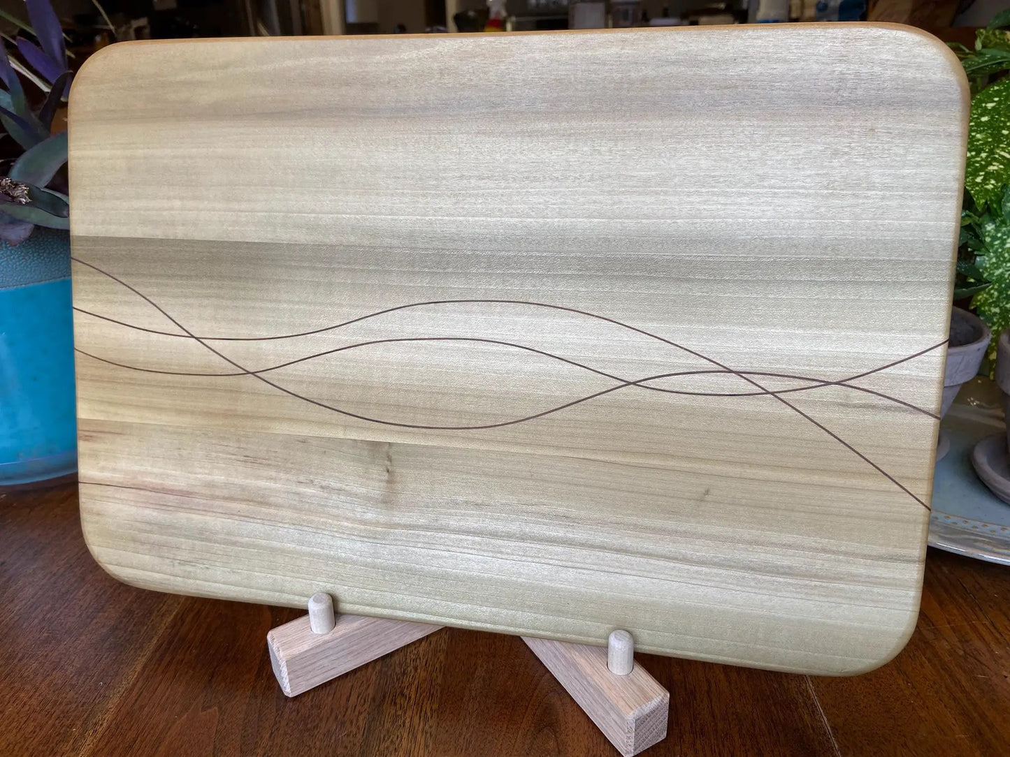 Poplar charcuterie board with walnut inlay, light wood with dark wave lines, serving tray on Tampa Home & Garden Store