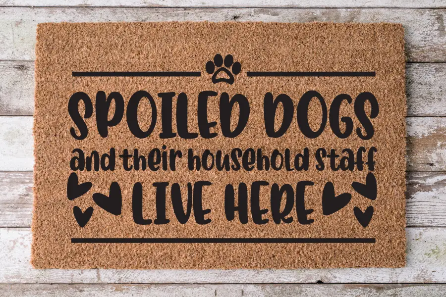 Coir door mat Spoiled Dogs and staff LIVE HERE, brown with black lettering 30x18 on Tampa Home & Garden Store