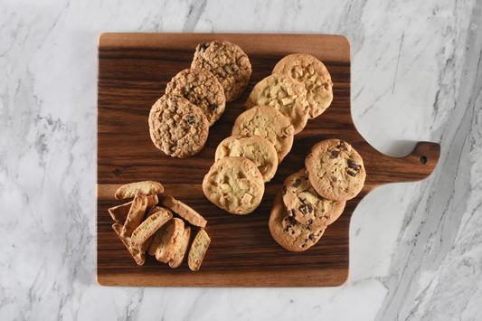 Square acacia wood cutting board with handle Kalmar Home cookies arranged on board on Tampa Home & Garden Store