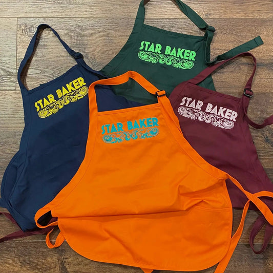 Star Baker embroidered apron set in assorted colors with ornate scrollwork on Tampa Home & Garden Store