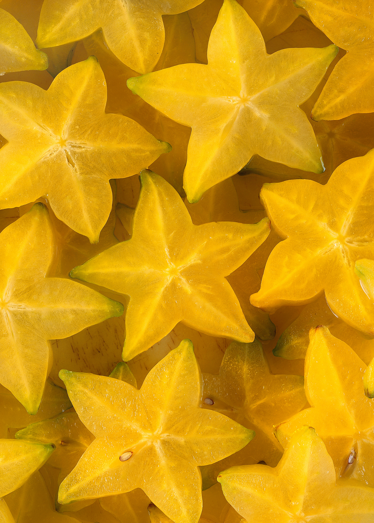 Star Fruit Tree Seedling Averrhoa Carambola, yellow starfruit slices close-up on Tampa Home & Garden Store