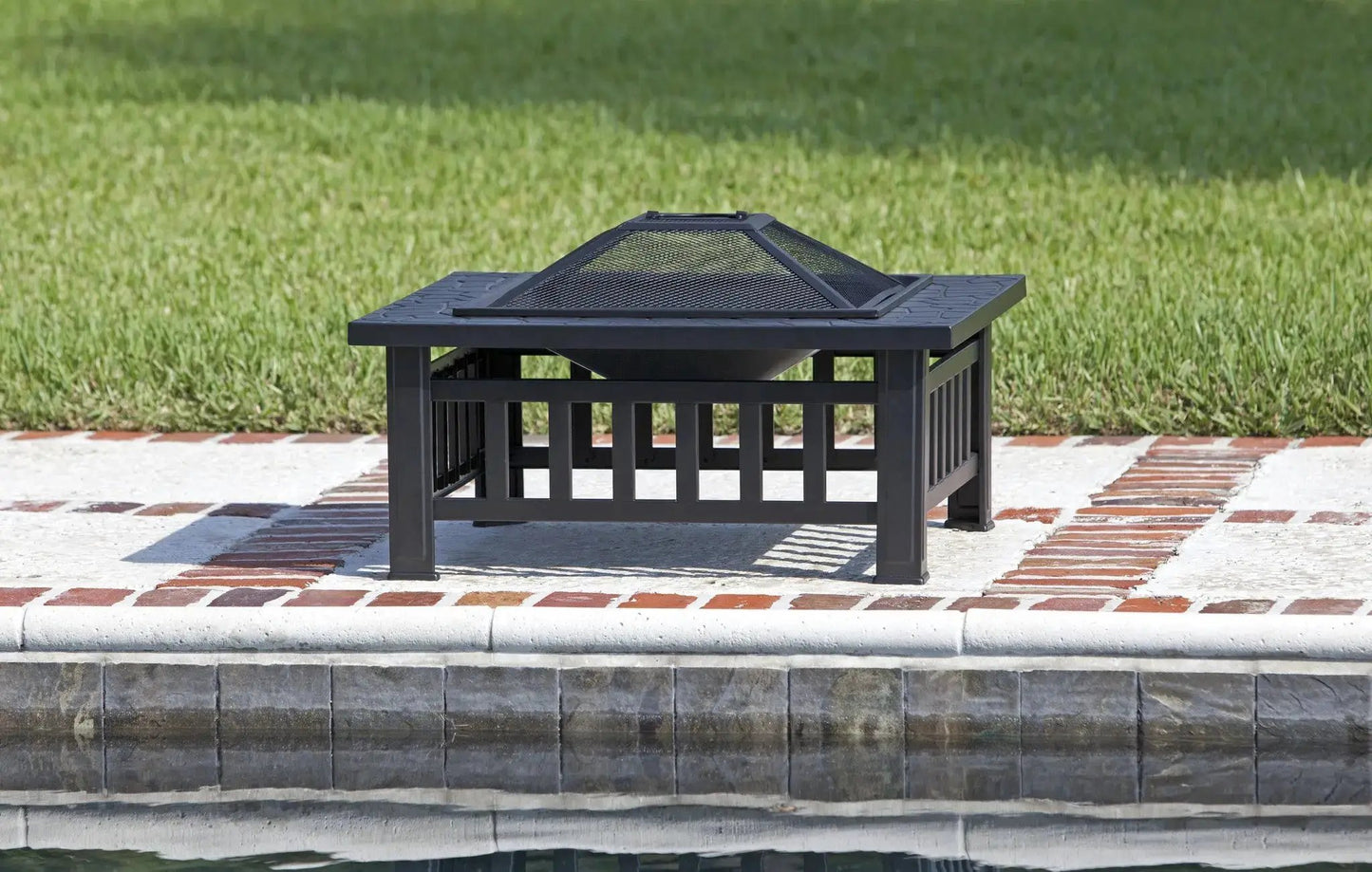 Stonemont Square Fire Pit with stone-look rim, black metal frame and pyramid mesh lid on Tampa Home & Garden Store