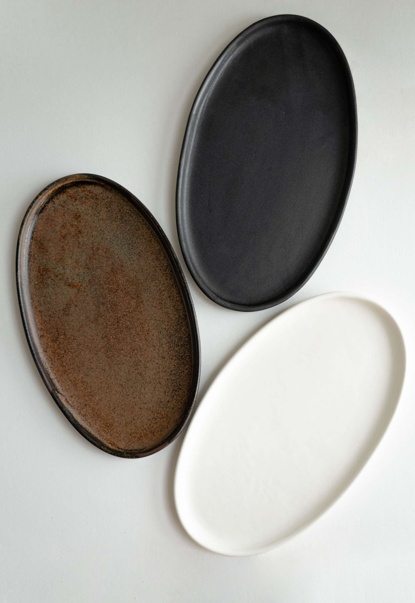 A Rust Matte Stoneware Serving Platter and Feast