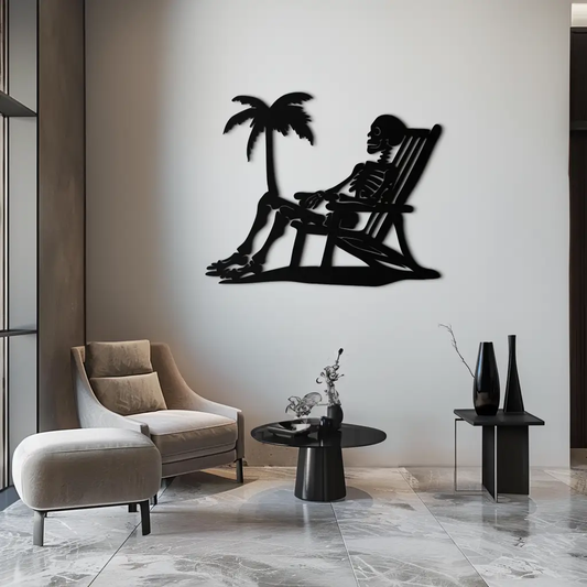 Sunbathing Skeleton Metal Wall Art in black silhouette with palm tree decor on wall on Tampa Home & Garden Store