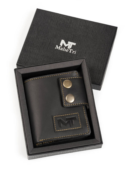 MaheTri Swift Hold Wallet in black leather with tan stitching and brass snaps in a box on Tampa Home & Garden Store