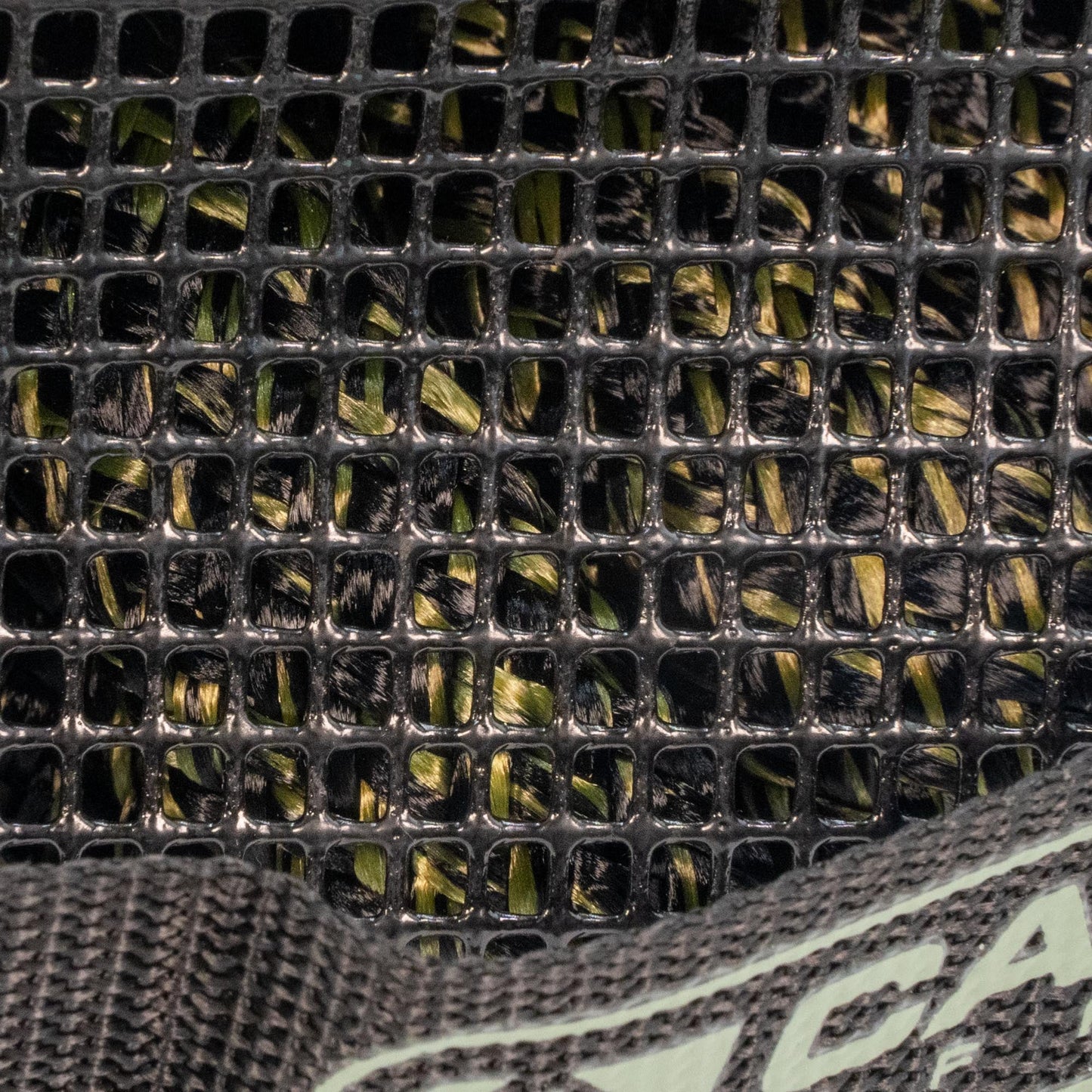 TAC 4x4 Recovery Rope and Soft Shackle braided green/black rope in a black grid mat on Tampa Home & Garden Store
