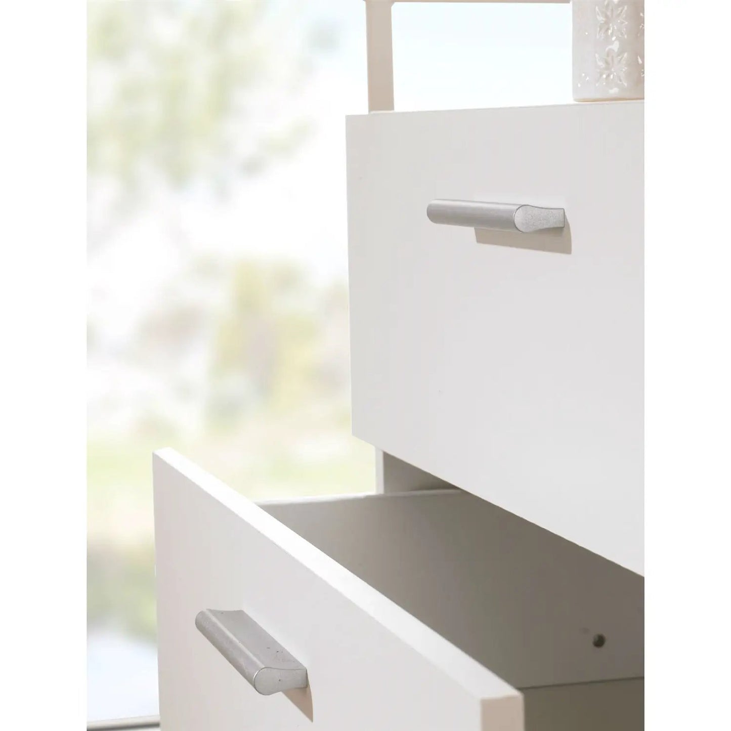 Contemporary white 4-drawer storage chest by HomePacific with silver cylindrical drawer pulls on Tampa Home & Garden Store