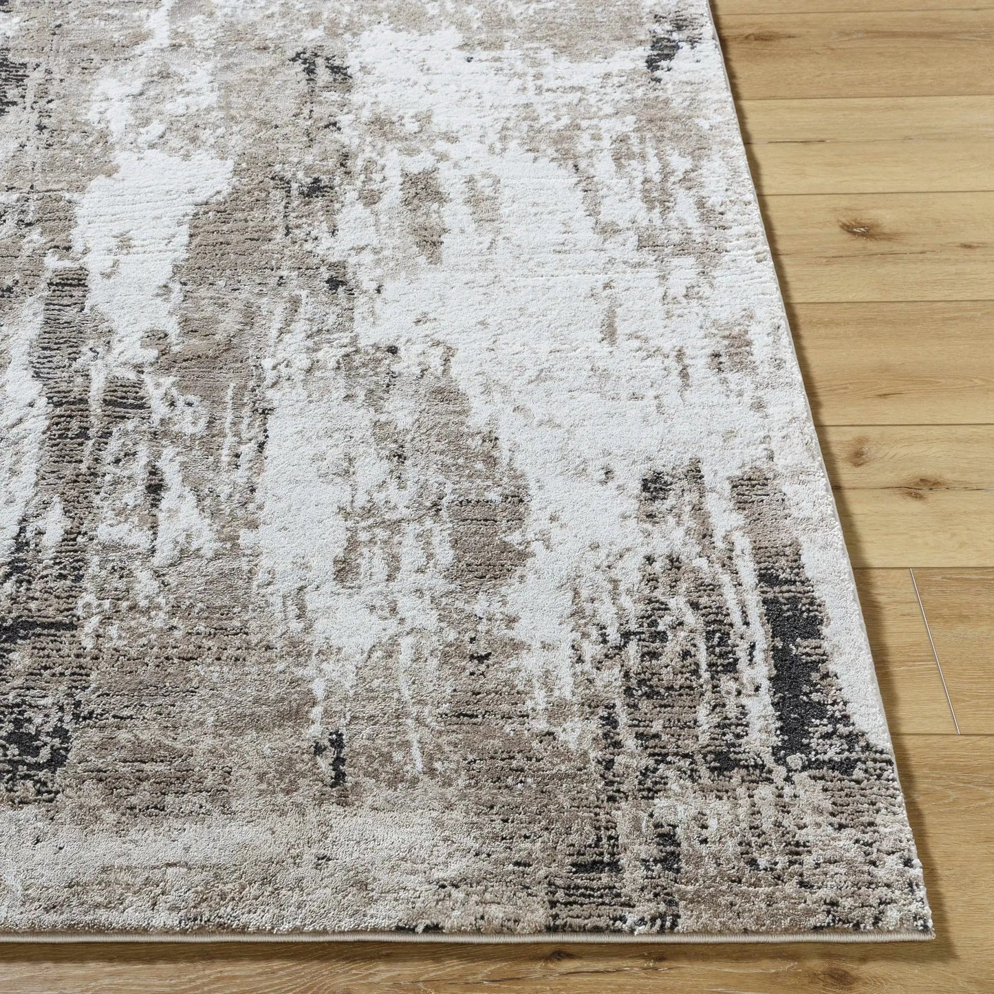 Taszi Luxe Thick Area Rug gray abstract pattern Boutique Rugs made in Turkey on wood floor on Tampa Home & Garden Store