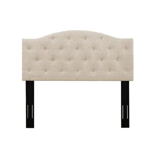 Twin beige fabric headboard with button tufting, curved top, and black wooden legs on Tampa Home & Garden Store
