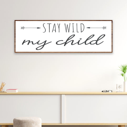 Stay Wild My Child canvas sign, white with black script and arrows, wood frame on Tampa Home & Garden Store